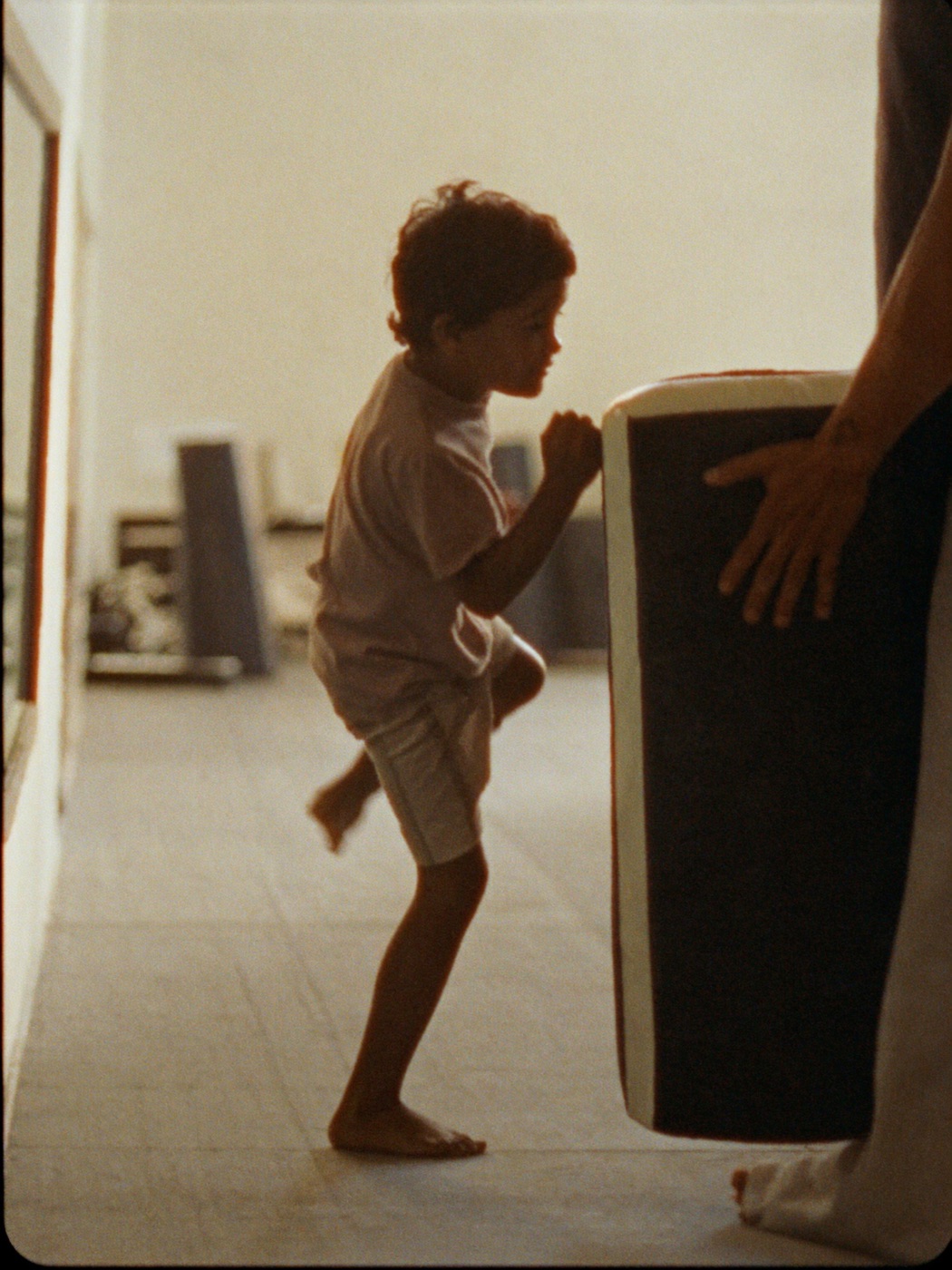 Kids working focus mitts in Muay Thai